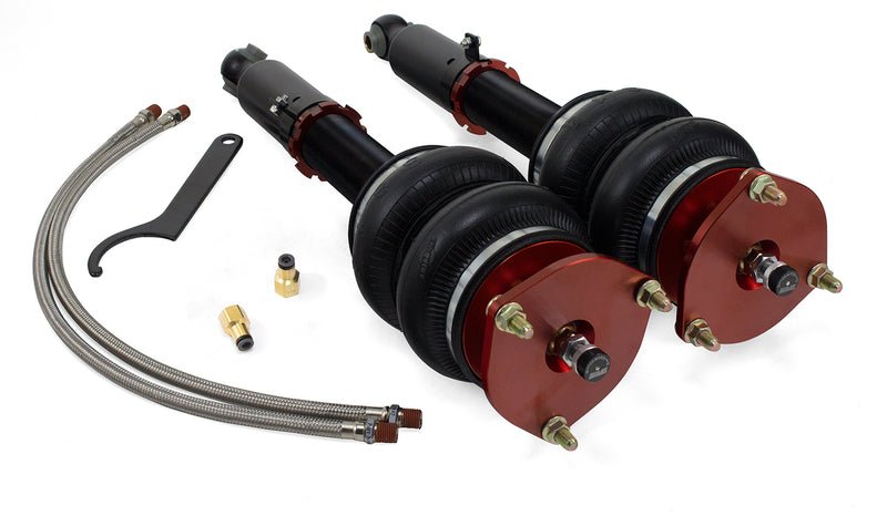 A pair of Air Lift Performance red accented monotube struts with compact double bellows progressive rate air springs along with stainless steel leader hoses, fittings and mounting hardware. Air suspension kit part