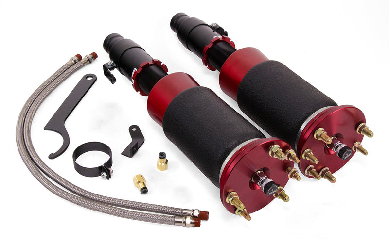 A pair of Air Lift Performance red accented threaded body air-over shocks with progressive rate sleeve-style air springs along with stainless steel leader hoses and mounting hardware. Air suspension kit part