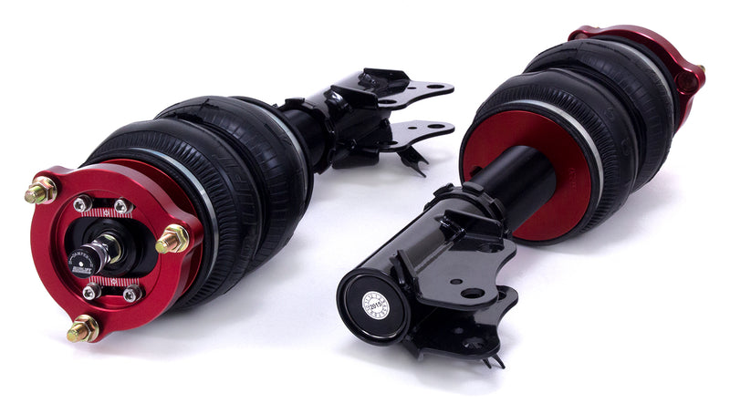 A pair of Air Lift Performance red accented high performance monotube shocks with double bellows progressive rate air springs with bolt-in camber plates and powdercoated gloss black mounting brackets.  Air suspension part