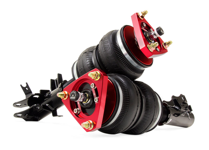 A pair of Air Lift Performance red accented threaded high performance monotube struts with double bellows progressive rate air springs with bolt-in camber plates. Air suspension kit part