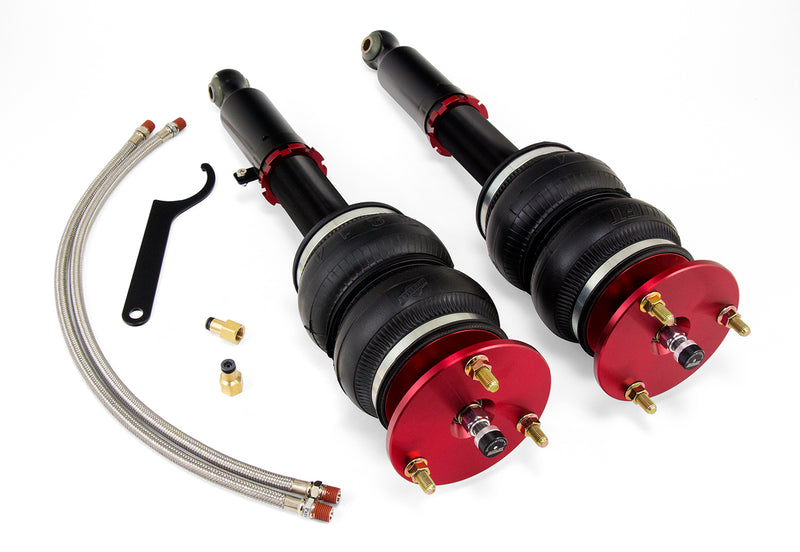A pair of Air Lift Performance red accented monotube struts with double bellows progressive rate air springs, braided stainless steel leader hoses and fittings. Air suspension kit part