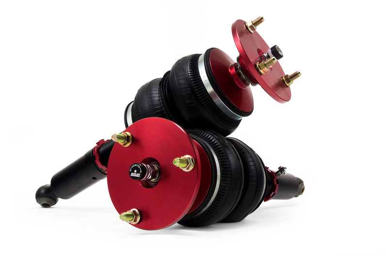 A pair of Air Lift Performance red accented monotube struts with double bellows progressive rate air springs. Air suspension kit part