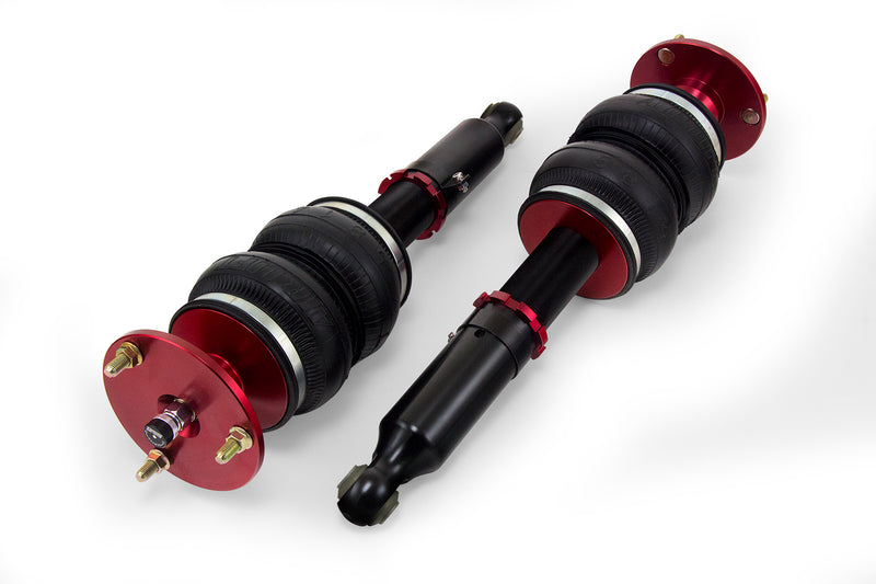 A pair of Air Lift Performance red accented monotube struts with double bellows progressive rate air springs.  Air suspension kit part