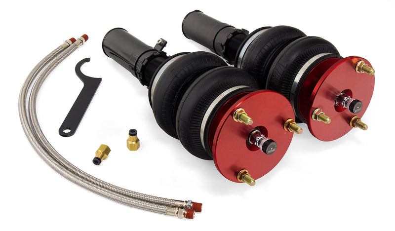A pair of red accented monotube struts with double bellows progressive rate air springs, braided stainless steel leader hoses and fittings. Air suspension kit part
