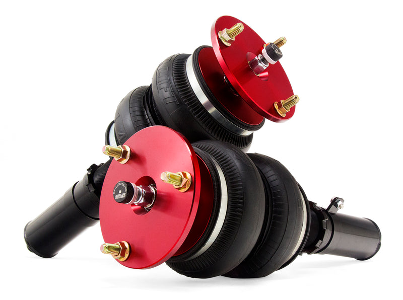 A pair of red accented monotube struts with double bellows progressive rate air springs. Air suspension kit part