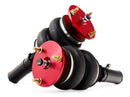 A pair of red accented monotube struts with double bellows progressive rate air springs.  Air suspension kit part