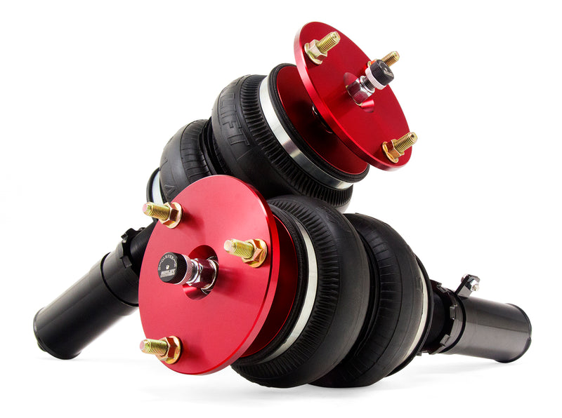 A pair of red accented monotube struts with double bellows progressive rate air springs.  Air suspension kit part