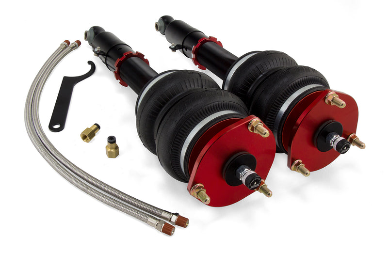 A pair of Air Lift Performance red accented monotube struts with compact double bellows progressive rate air springs along with stainless steel leader hoses and fittings. Air suspension kit part