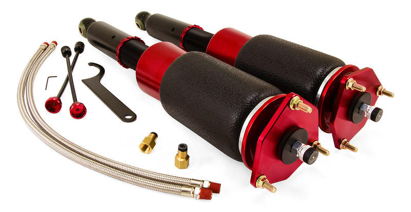 A pair of Air Lift Performance red accented threaded body air-over shocks with progressive rate sleeve-style air springs with powdercoated gloss black steel brackets, pair of braided stainless steel leader hoses and fittings. Air suspension kit part