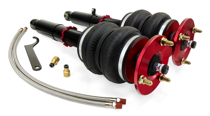A pair of Air Lift Performance red accented monotube struts with double bellows progressive rate air springs, braided stainless steel leader hoses and fittings.   Air suspension kit part