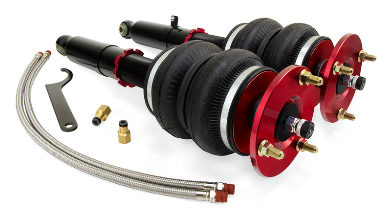 A pair of Air Lift Performance red accented monotube struts with double bellows progressive rate air springs, braided stainless steel leader hoses and fittings. Air suspension kit part