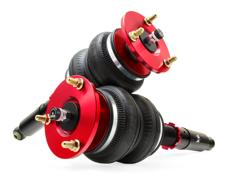 A pair of Air Lift Performance red accented monotube struts with double bellows progressive rate air springs.  Air suspension kit part