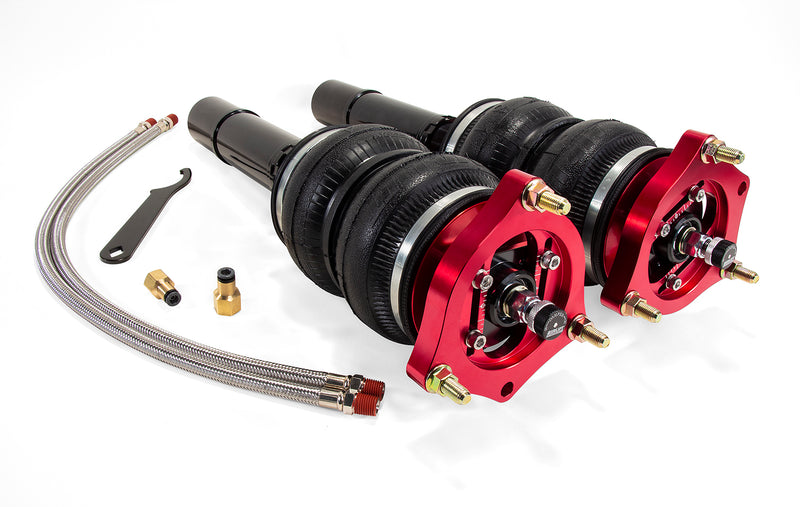 A pair of Air Lift Performance red accented high performance monotube shocks with double bellows progressive rate air springs, powder coated gloss black mounting brackets and braided stainless steel leader hoses. Air suspension kit part