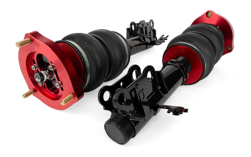 A pair of Air Lift Performance red accented monotube struts with double bellows progressive rate air springs with bolt-in camber plates and powdercoated gloss black steel mounting brackets.  Air suspension kit