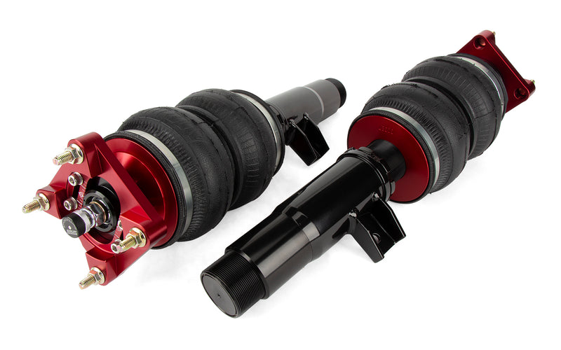A pair of Air Lift Performance red accented monotube shocks with double bellows progressive rate air springs withbolt-in camber plates. Air suspension kit part