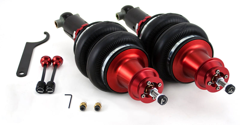 A pair of Air Lift Performance red accented threaded body air-over shocks with double bellows progressive rate air springs along with remote damping extenders and fittings. Air suspension part