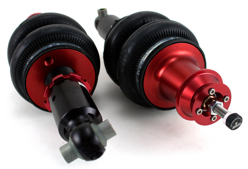 A pair of Air Lift Performance red accented threaded body air-over shocks with double bellows progressive rate air springs. Air suspension part