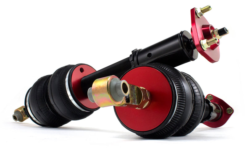 A pair of Air Lift Performance red accented monotube struts with compact double bellows progressive rate air springs.  Air suspension kit part