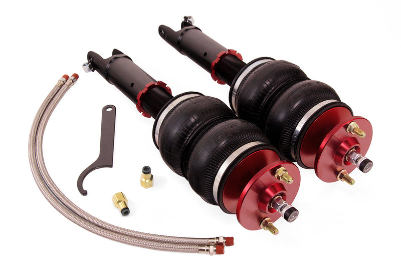 A pair of anodized red accented high performance monotube shocks with double bellows progressive rate air springs along with stainless steel leader hoses and fittings. Air suspension kit part