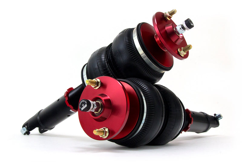 A pair of anodized red accented high performance monotube shocks with double bellows progressive rate air springs. Air suspension kit part