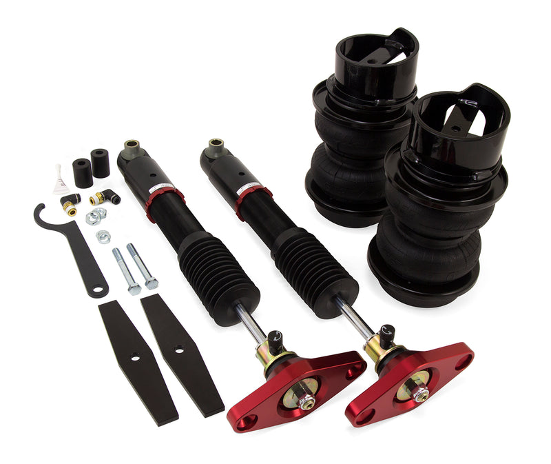 A pair of Air Lift Performance red accented threaded monotube struts with double bellows progressive rate springs with roll plates and installation hardware. Air suspension kit part