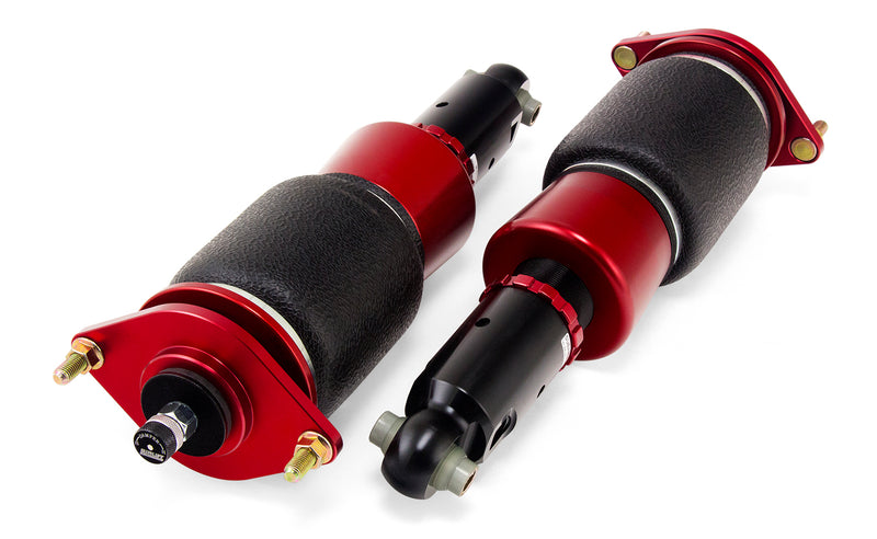 A pair of Air Lift Performance red accented threaded body air-over shocks with progressive rate sleeve-style air springs, stainless steel leader hoses and fittings. Air suspension kit part