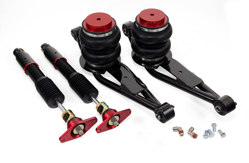 A pair of Air Lift Performance red accented monotube threaded shocks with double bellows progressive rate air springs and lower control arms. Air suspension kit