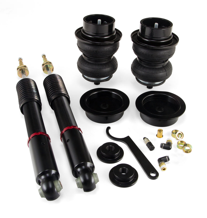 A pair of Air Lift Performance red accented threaded body monotube shocks with black double bellows progressive rate air springs with roll plates, power coated gloss black steel brackets and fitting.  Air suspension kit part