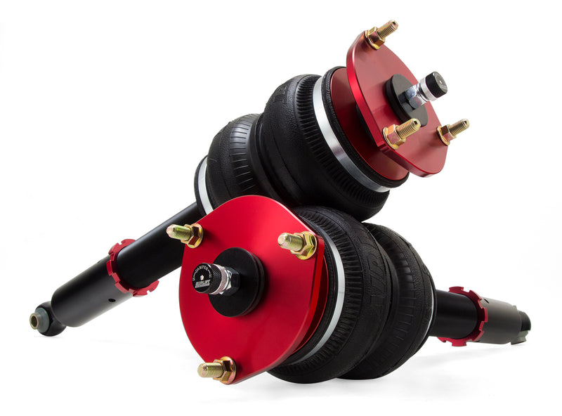 A pair of Air Lift Performance red accented monotube struts with compact double bellows progressive rate air springs.  Air suspension kit part