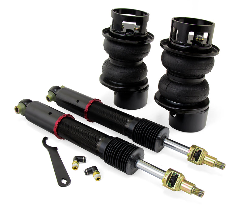 A pair of Air Lift Performance red accented threaded monotube struts with black accented double bellows progressive rate air springs, roll plates and fittings.  Air suspension part