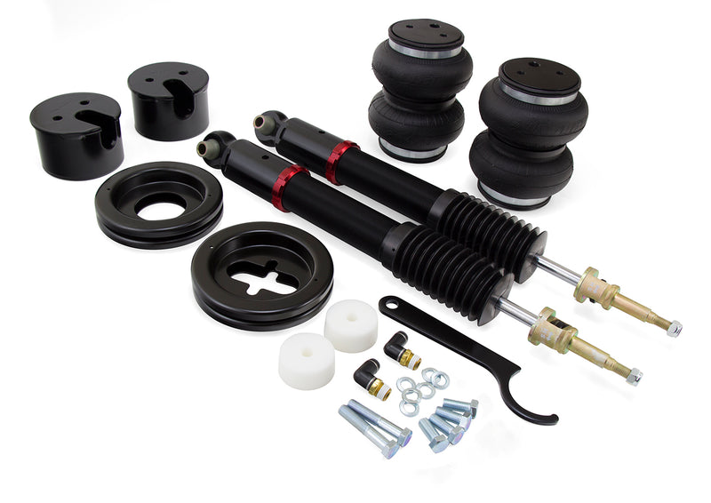 A pair of Air Lift Performance red accented threaded body monotube shocks with anodized aluminum accented double bellows progressive rate air springs along with roll plates, gloss black powdercoated steel brackets and fitments. Air suspension kit part