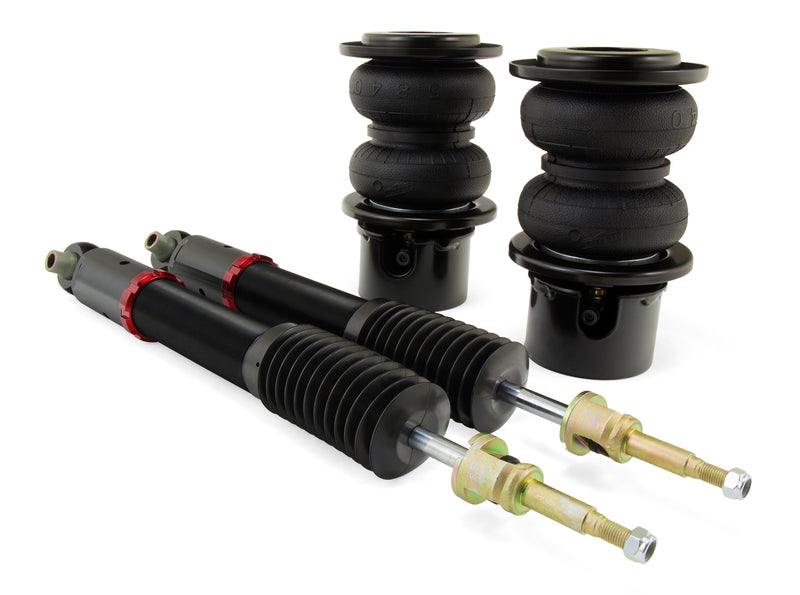 A pair of Air Lift Performance red accented threaded body monotube shocks with anodized aluminum accented double bellows progressive rate air springs. Air suspension kit part