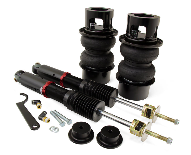 A pair of Air Lift Performance red accented air-over monotube struts with black accented double bellows progressive rate springs with integrated roll plates and fitments. Part