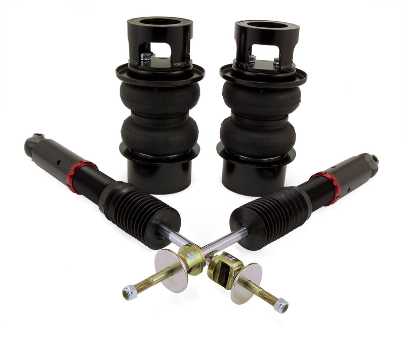 A pair of Air Lift Performance red accented air-over monotube struts with black accented double bellows progressive rate springs with integrated roll plates.  Part
