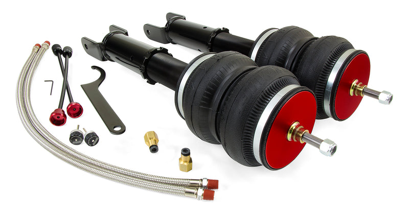 A pair of Air Lift Performance red accented monotube struts with double bellows progressive rate air springs with powdercoated gloss black steel brackets, remote damping extenders, pair of braided stainless steel leader hoses and fittings. Air suspension kit part