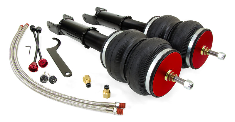 A pair of Air Lift Performance red accented monotube struts with double bellows progressive rate air springs with powdercoated gloss black steel brackets, remote damping extenders, pair of braided stainless steel leader hoses and fittings.  Air suspension kit part