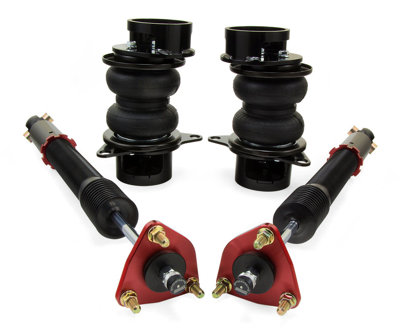 A pair of Air Lift Performance red accented monotube struts with double bellows progressive rate air springs, roll plates and powdercoated gloss black steel brackets. Air suspension kit part