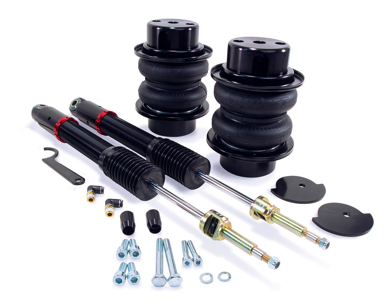 A pair of Air Lift Performance red accented monotube shocks and anodized aluminum accented black double bellows progressive rate air springs along with roll plates and mounting hardware. Air suspension kit part