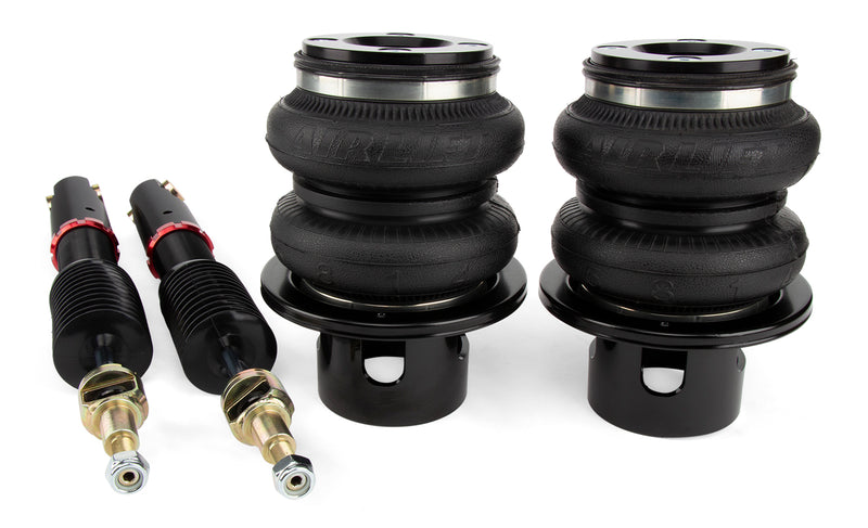 A pair of Air Lift Performance high performance monotube struts with black double bellows progressive rate air springs with anodized aluminum accents and powdercoated gloss black mounting brackets.  Air suspension kit part