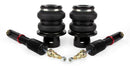 A pair of Air Lift Performance high performance monotube struts with black double bellows progressive rate air springs with anodized aluminum accents and powdercoated gloss black mounting brackets.  Air suspension kit part