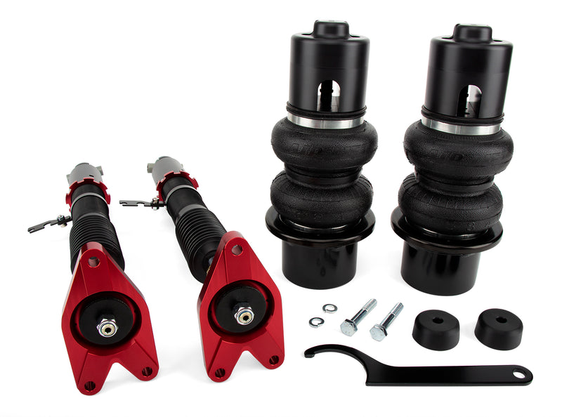 A pair of Air Lift Performance red accented monotube shocks, double bellows progressive rate air springs with anodized aluminum accents along with powdercoated gloss black steel brackets and fittings. Air suspension kit part