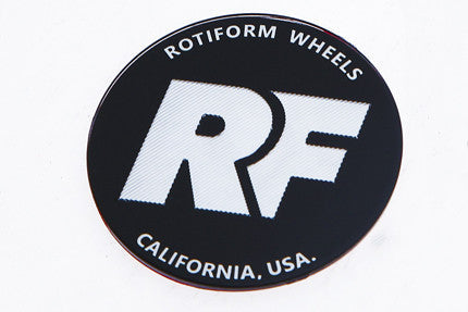 Rotiform's black and silver RF center cap insert for threaded hex nut.