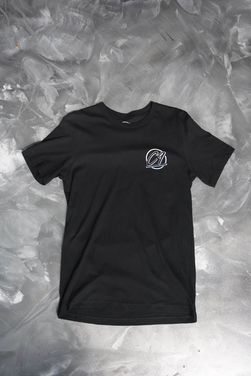 Front View of a black T-shirt with the round Cloud 9 Automotive Brand logo below the left shoulder.