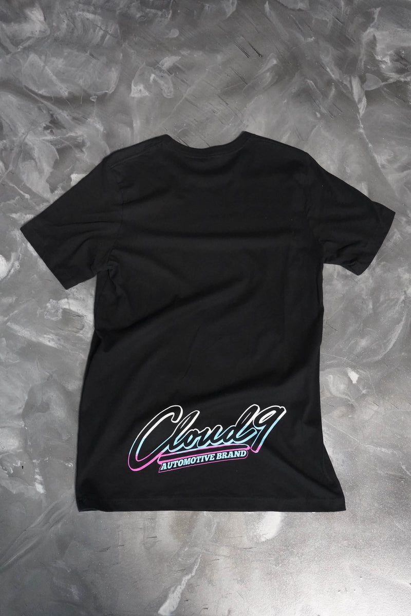 Rear of a black T-shirt with the Cloud 9 Automotive brand full color logo to the bottom of the shirt.