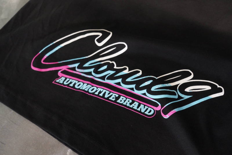Close up of the Cloud 9 Automotive full color logo at the bottom of the black T-shirt.