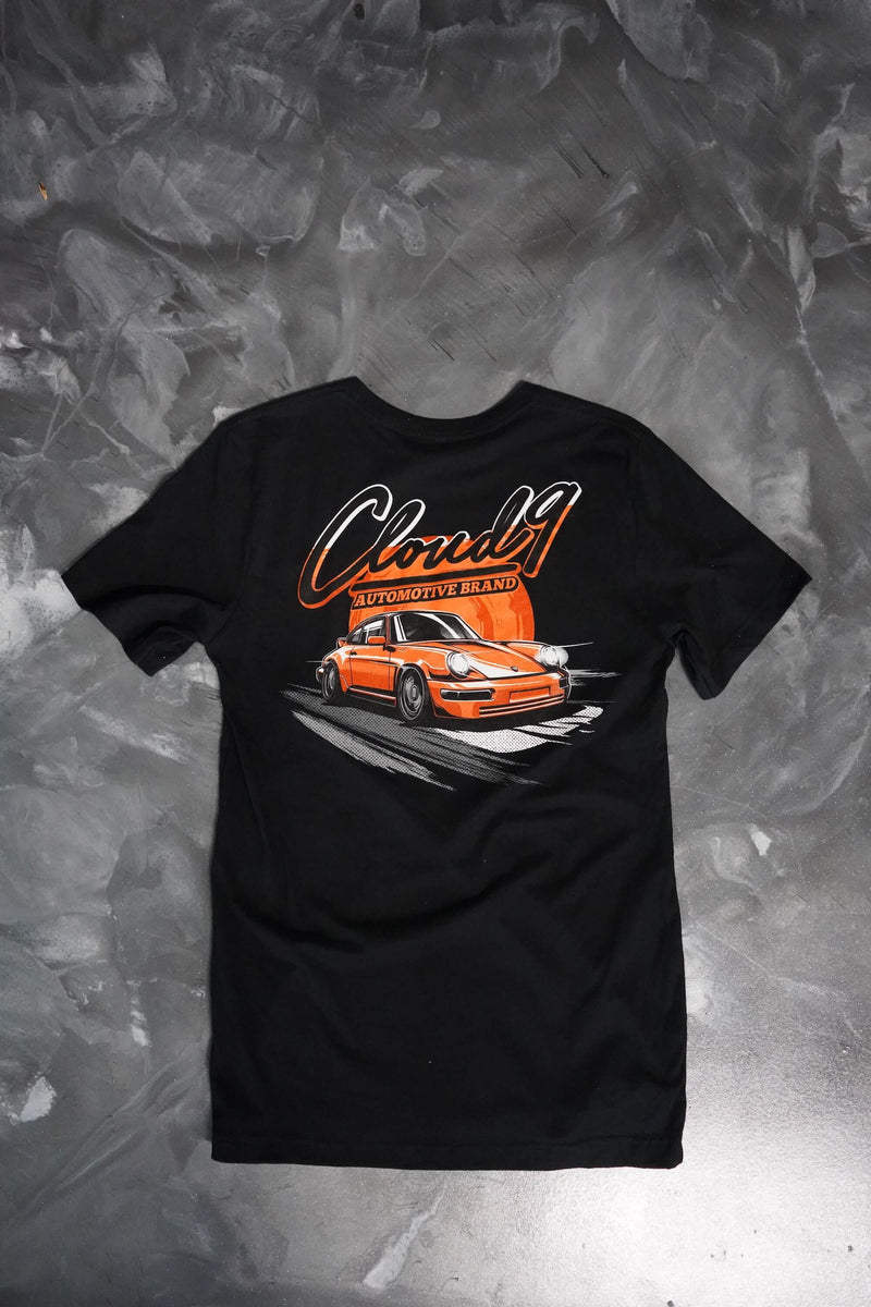 Rear of a black T-shirt with the orange Porsche graphic with the Cloud 9 Automotive Brand logo above.