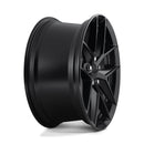 Side view of a Rotiform FLG monoblock cast aluminum 5 double V shape spoke design automotive wheel in a matte black finish with a black Rotiform logo center cap.