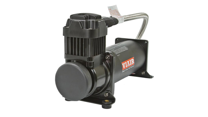 Black VIAIR compressor with fitted braided leader hose.