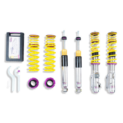2 chrome body coilovers with yellow springs and purple accented fittings, 2 chrome body coilovers, 2 yellowsprings and 2 purple fittings, 2 coilover adjustment tool and storage box.