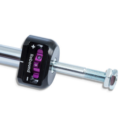 Close up view of rebound adjustment knob at end of coilover.